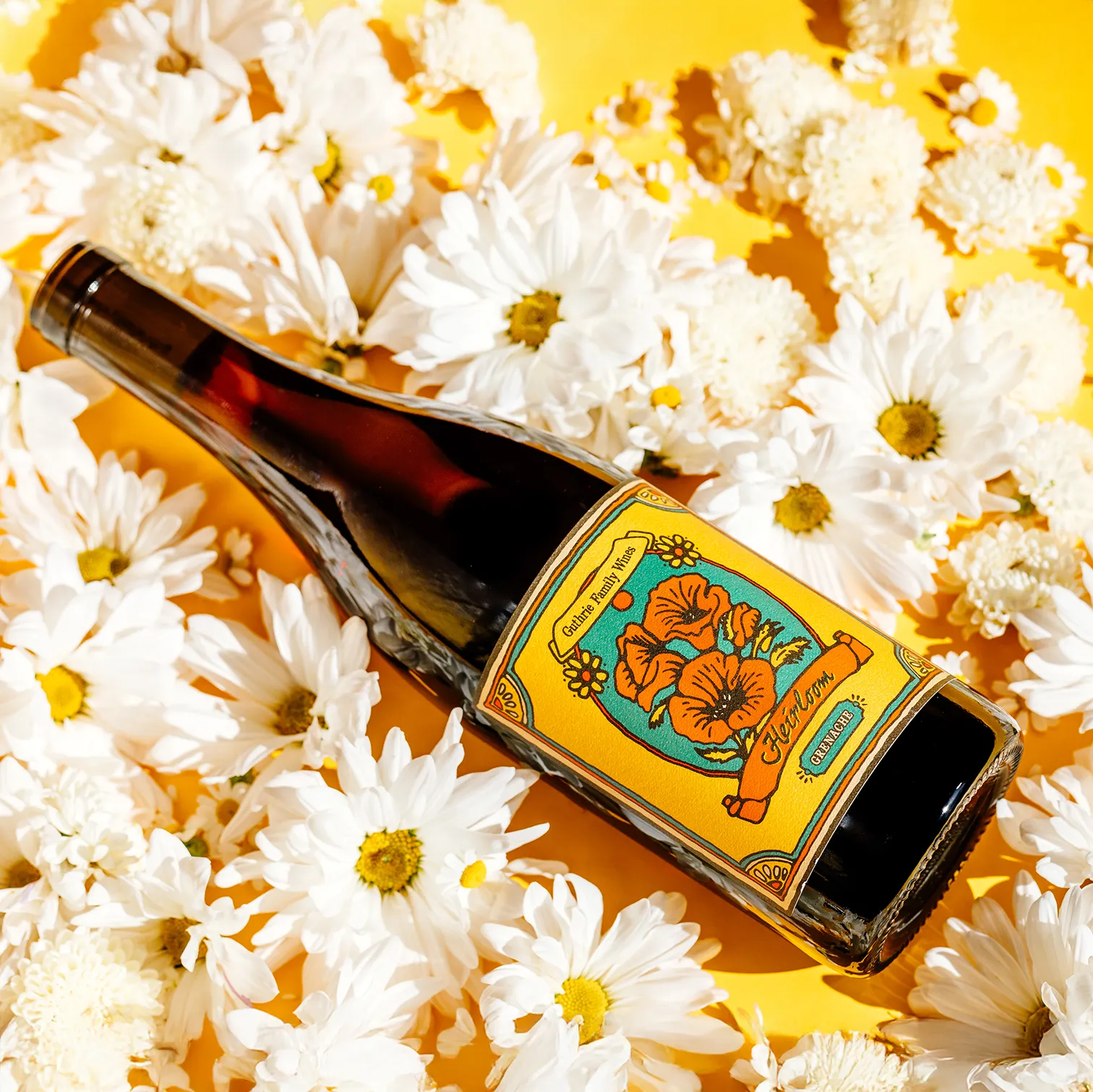 Guthrie Family Wine bottle on a bed of flowers