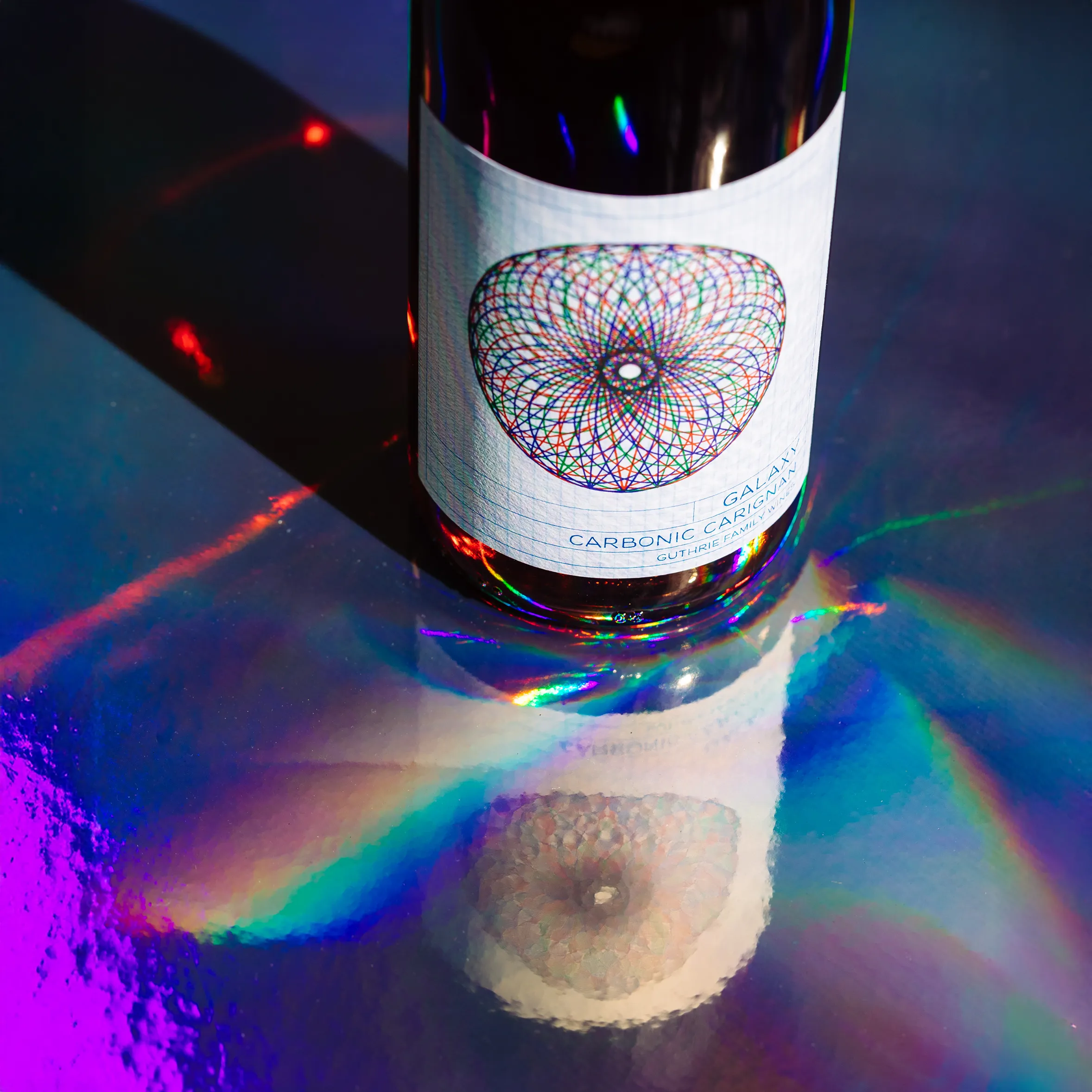 Guthrie Family Wine Bottle with rainbow reflecting light